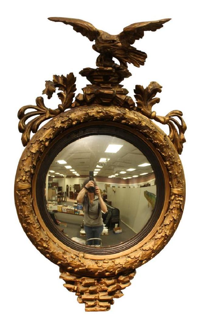 Federal Convex Mirror: 19th c. Gilt gesso frame with eagle pediment, acanthus leaf and ebonized frame, measuring 36.5"h x 22"w