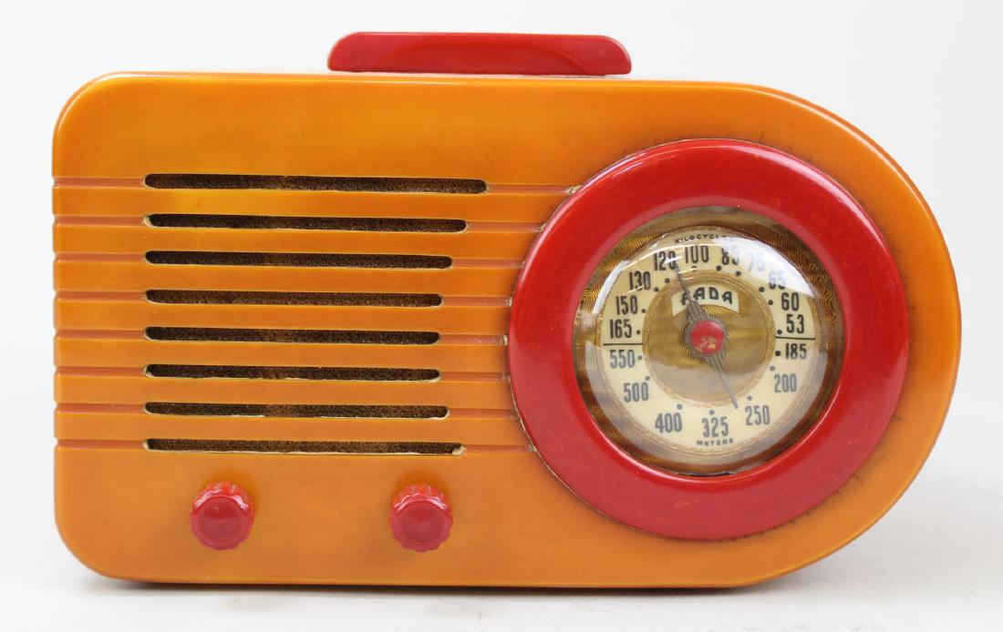 Fada Catalin "Bullet" Radio: Model 1000. c. 1945.Post-war Â“bulletÂ” with Yellow body, red knobs, handle and grill surrounds. No cracks on body. Dial face shows mild warping but does not impede tuning. Cord intact. Powers o