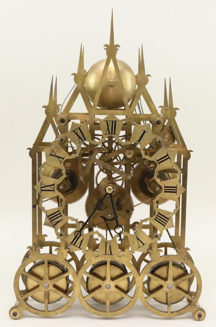 Fusee Skeleton Clock: Victorian Gothic style triple fusee clock with open face dial. 24”h x 18”w x 6”d