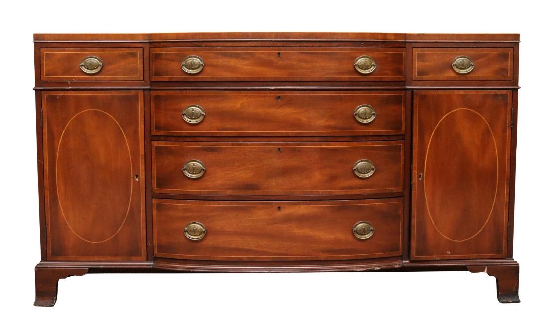 Kittinger Mahogany Bow Front Sideboard: Banded inlay with four graduated drawers flanked by one drawer over one door on each side on ogee feet. 37”h x 67”w x 20”d