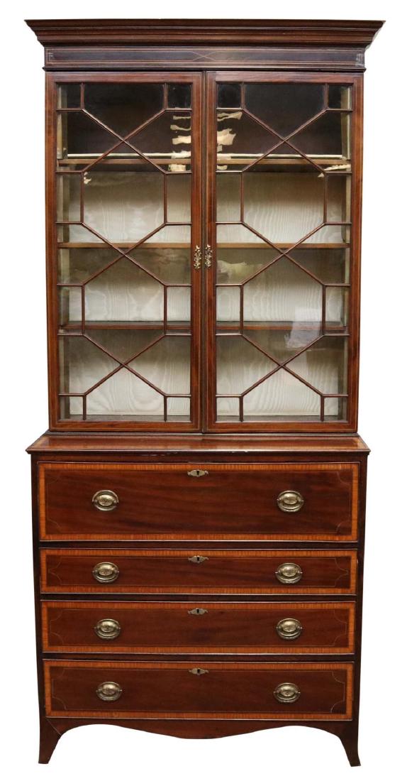 English Hepplewhite Secretary: Mahogany with banded inlay and oak secondary. Molded cornice, two doors over a fall front desk with fitted interior and leather inset top. Three graduated drawers with a scrolled apron on French feet