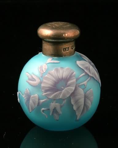 Thomas Webb Style Cameo - Rare Three Color: loral design in white, mauve on pale blue, silver screw cap engraved with monogram and date 1919. Lack internal stopper. Hallmark: London 1887. 2" h. Shipping: $18.