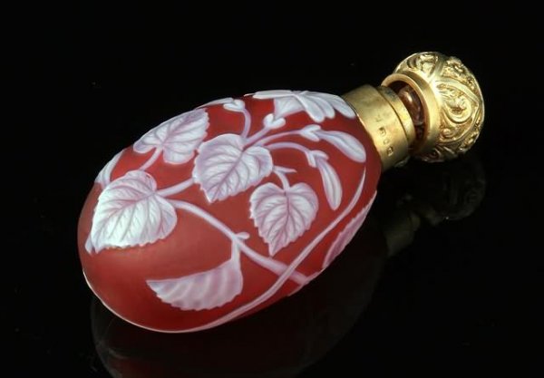 Thomas Webb Style Cameo Glass Perfume Bottle: Floral design in white on ruby with butterfly, silver gilt stopper in Moorsih taste, has original internal stopper, 3 1/4"h. Shipping: $18