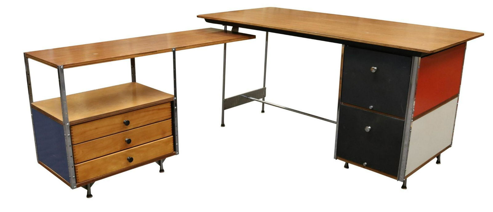 Charles Eames for Herman Miller ESU Desk and Return: Birchwood tops with red, white and blue lacquered panels, five drawers on a chrome frame. 29"h x 60"w x 72"d