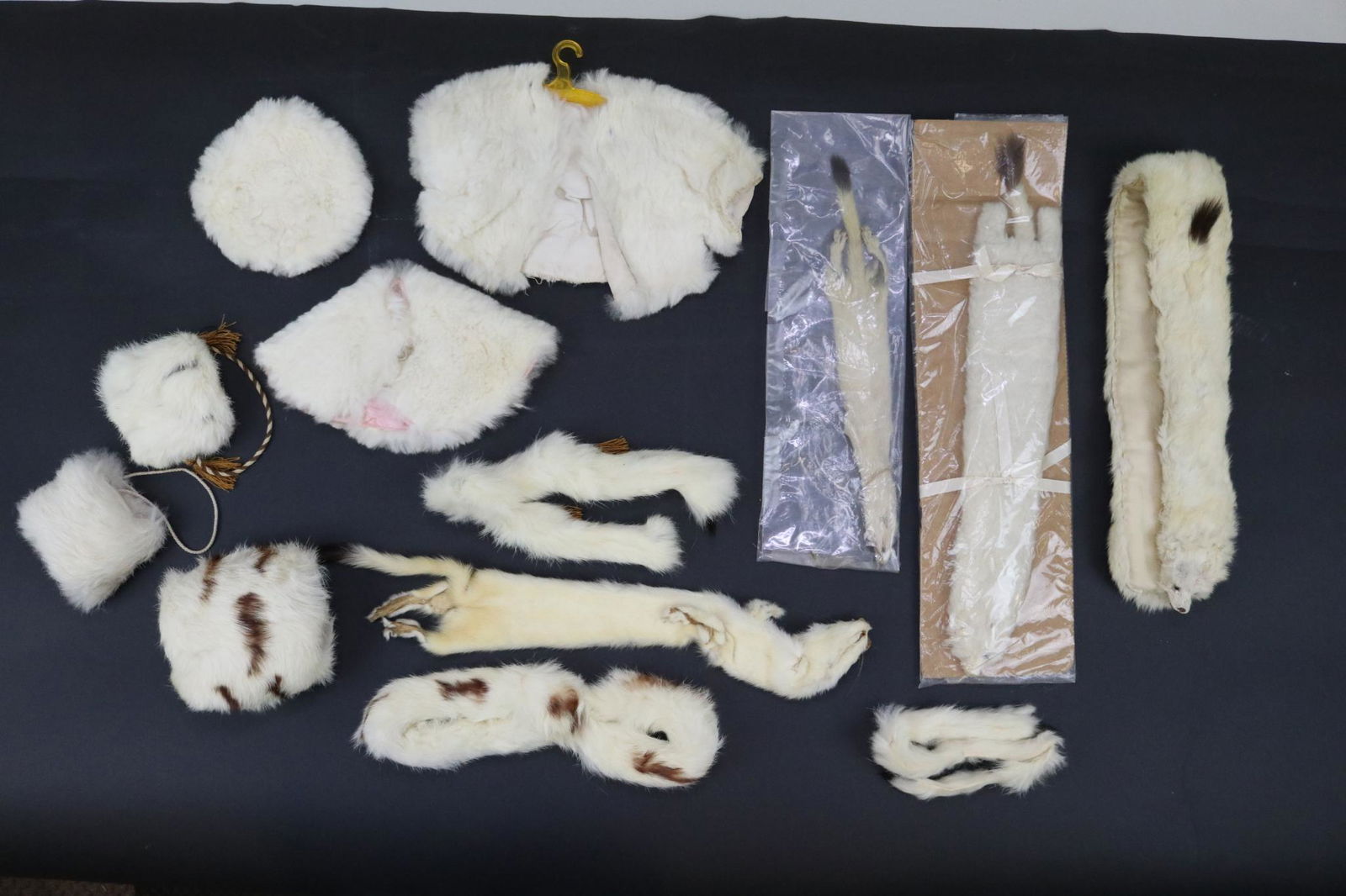 ANTIQUE/VINTAGE DOLL CLOTHING.: Lot of antique fur doll accessories. "Ermine" wrap, neck piece, (2) full pelts, muff. 3 Pc. "Ermine" muff, and neck pieces. White rabbit coat, hat, cape and muff. This lot is being sold AS IS.