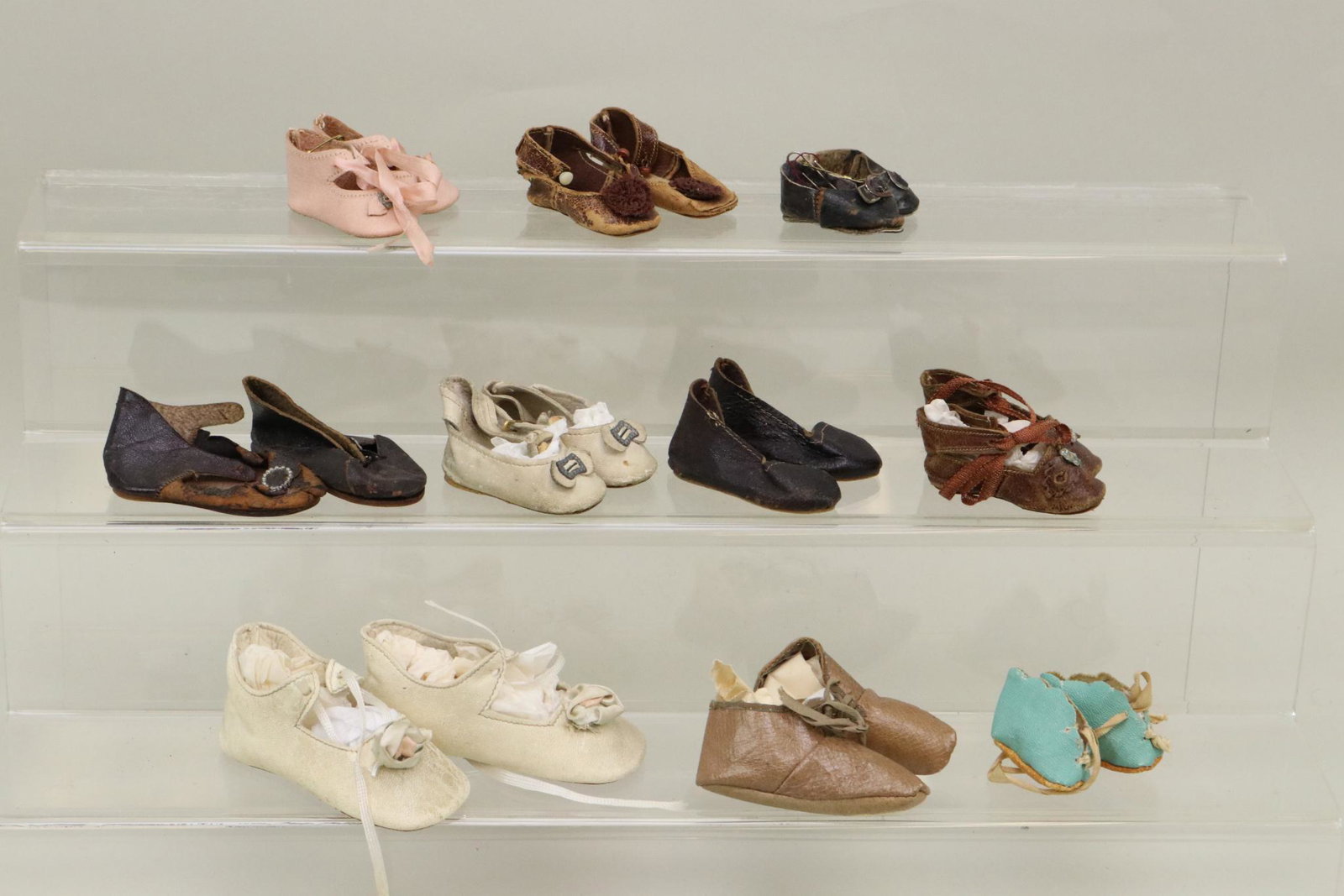 LOT OF DOLL SHOES.: Lot of (10) prs. of leather shoes. 1" (Booties) - 3 3/4". This lot is bing sold AS IS.