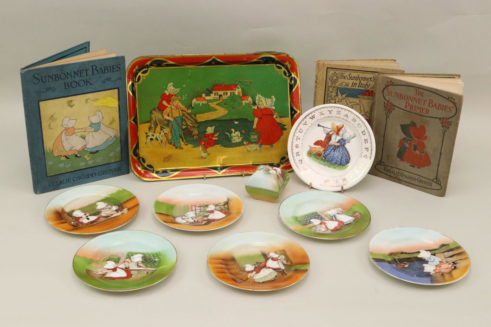 LOT OF TOY(S).: Lot of Sunbonnet Sue items. 9" x 13" Tin tray AMSCO Eliz. N.J. U.S.A. 6 1/2" China alphabet plate "Three of Us". Souvenir of ELIZABETHTOWN, N.Y. Lot of (6) 6" china plates. Royal Bayreuth Bavaria: two