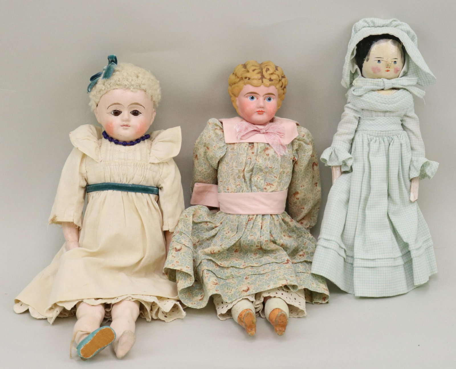 LOT OF METAL, PAPIER MACHE, WOOD DOLL(S).: Lot of (3) dolls. 15" Papier mache shoulder head doll with stationary brown eyes, fur wig. Cloth body with papier mache lower limbs. Dressed in antique clothing. (1) Turquoise oilcloth shoe. 14 1/2" "