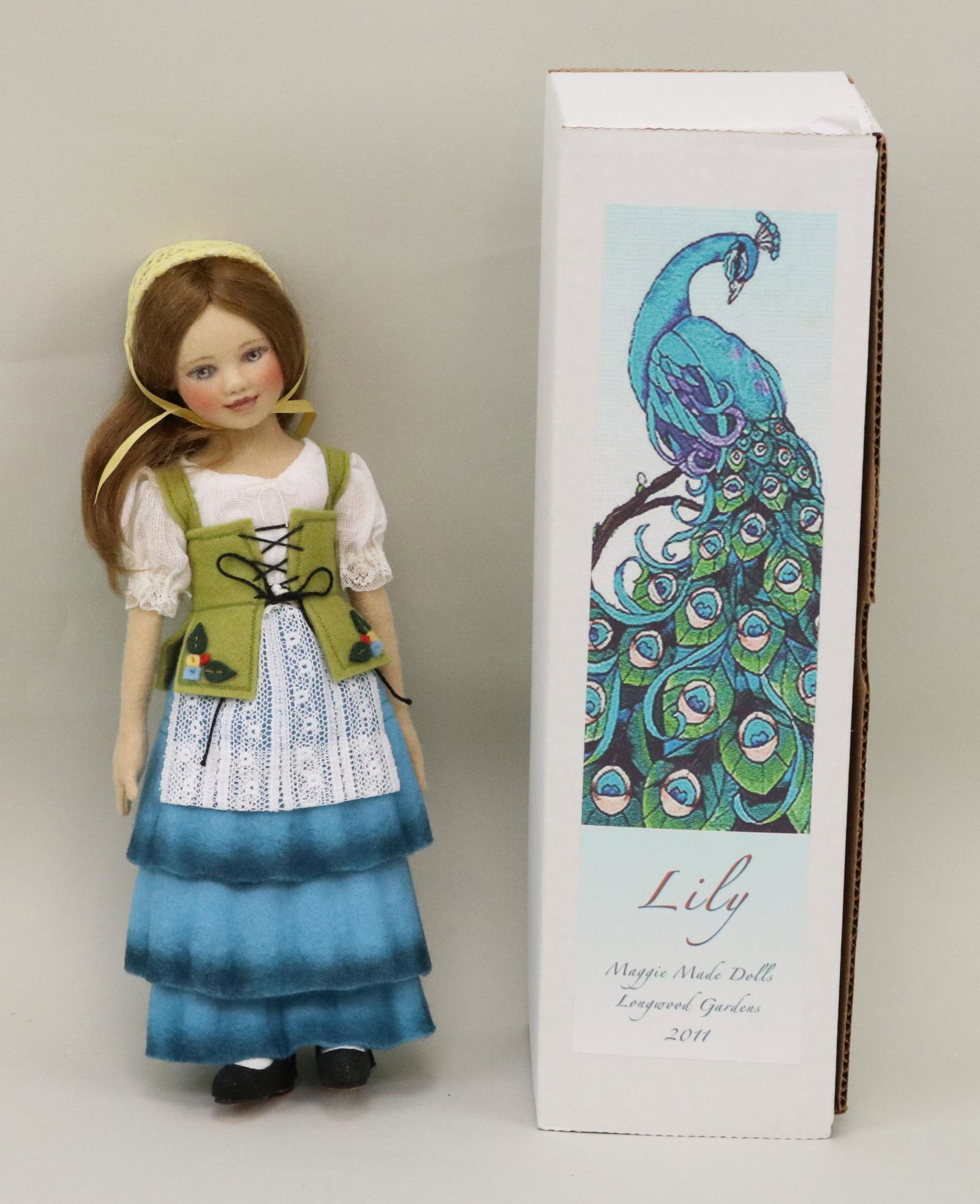 LOT OF ARTIST DOLL(S).: 10 1/2" MIB "Lily" doll made by artist Maggie Iacono for the Saturday, June 25, 2011 luncheon at Longwood Gardens, Kennett Square, PA. Left sole is signed.