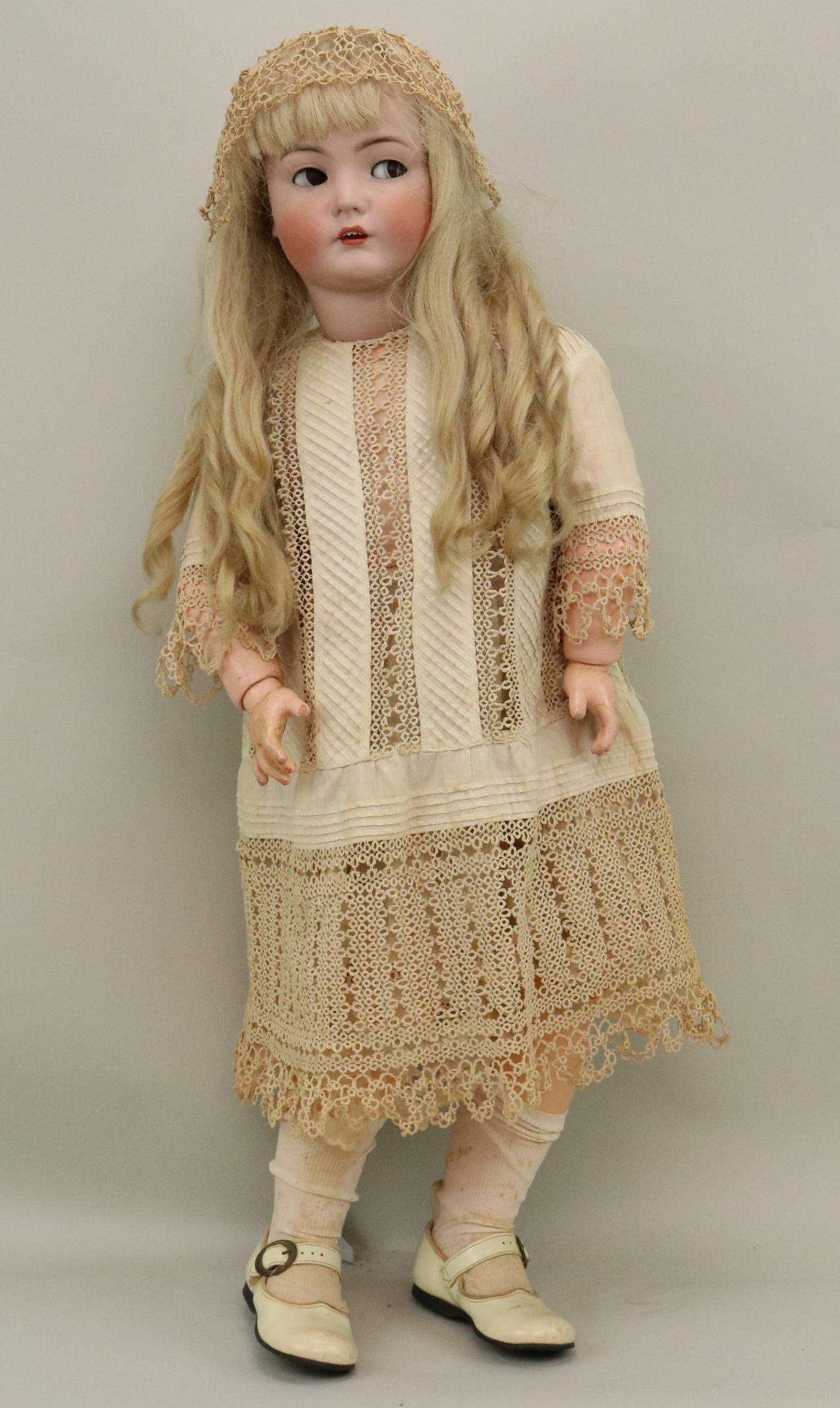 ANTIQUE GERMAN BISQUE DOLL.: 34" K * R 117n (Mein Leibling) doll with brown flirty sleep eyes, open mouth, long blonde French human hair wig. Papier mache ball jointed body. Dressed in all antique clothing: interesting white cott