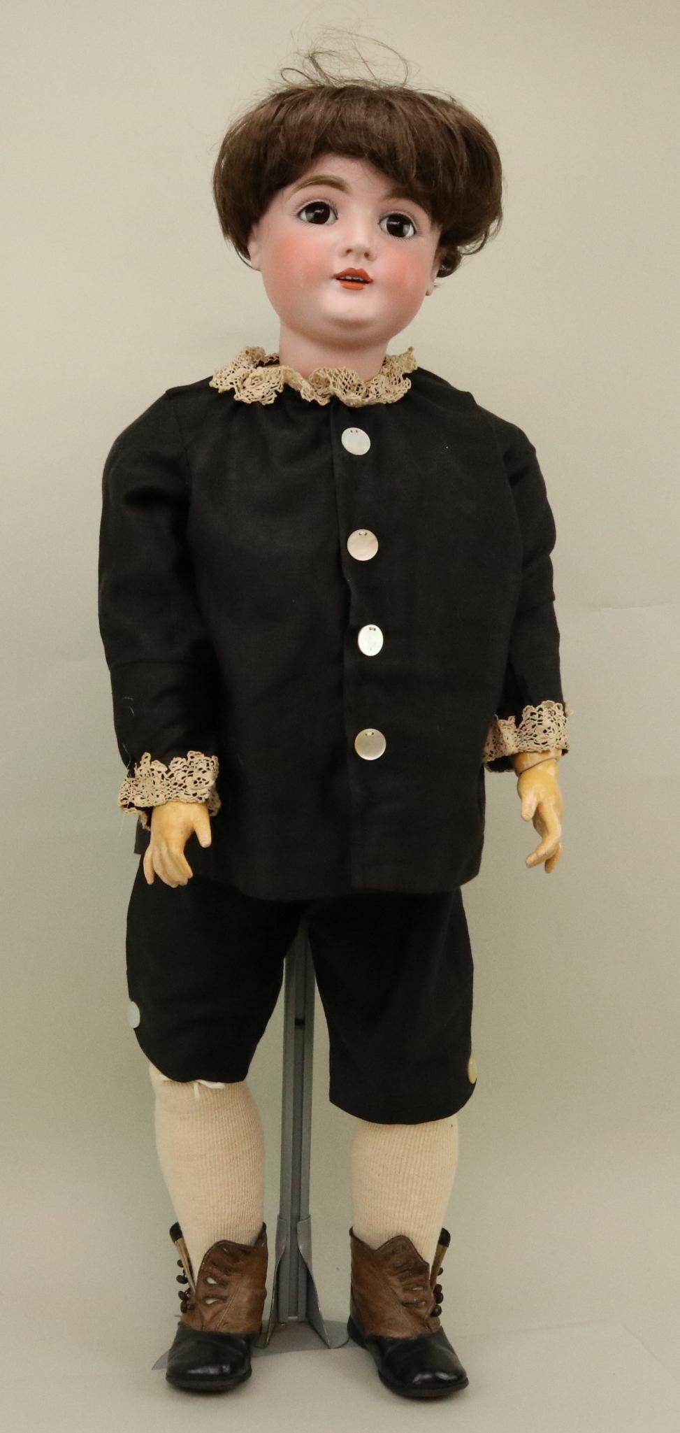 ANTIQUE GERMAN BISQUE DOLL.: 36" M MADE IN GERMANY 16 164 doll with brown sleep eyes, open mouth, brown synthetic baby/boy's wig. Papier mache ball jointed body. Dressed in vintage 2 pc. black cotton suit with large mother-of-pea