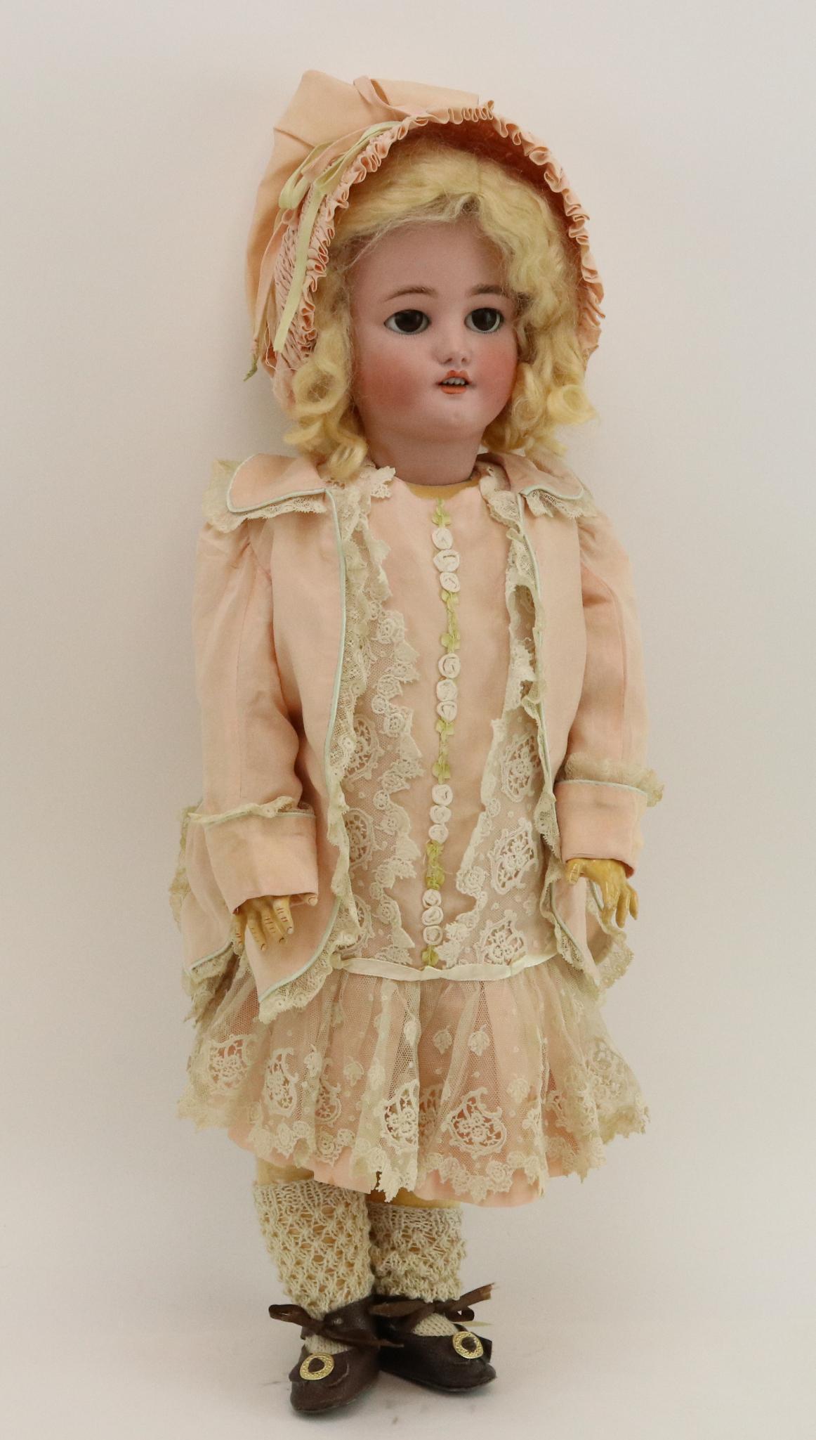 ANTIQUE GERMAN BISQUE DOLL.: 21 1/2" C.M. BERGMANN SIMON & HALBIG 8 1/2 doll with brown sleep eyes, fluffy lashes, open mouth, pierced ears, very curly blonde mohair wig. Papier mache ball jointed body. Dressed in newer reproduct