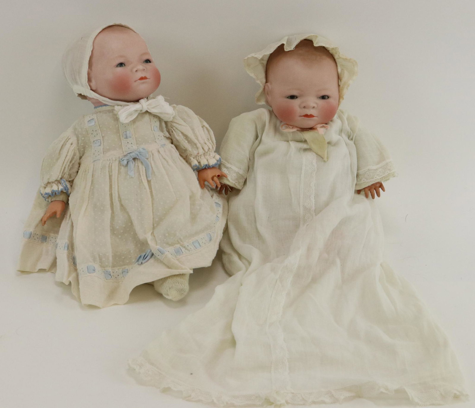 ANTIQUE GERMAN BISQUE DOLL(S).: Pair of 13 1/2" "Byelo" babies with 12 1/2" cir. heads. Copr. By Grace S. Putnam MADE IN GERMANY. Both have sleep eyes, closed mouths, light brown painted hair. Cloth "frog" bodies with celluloid hand