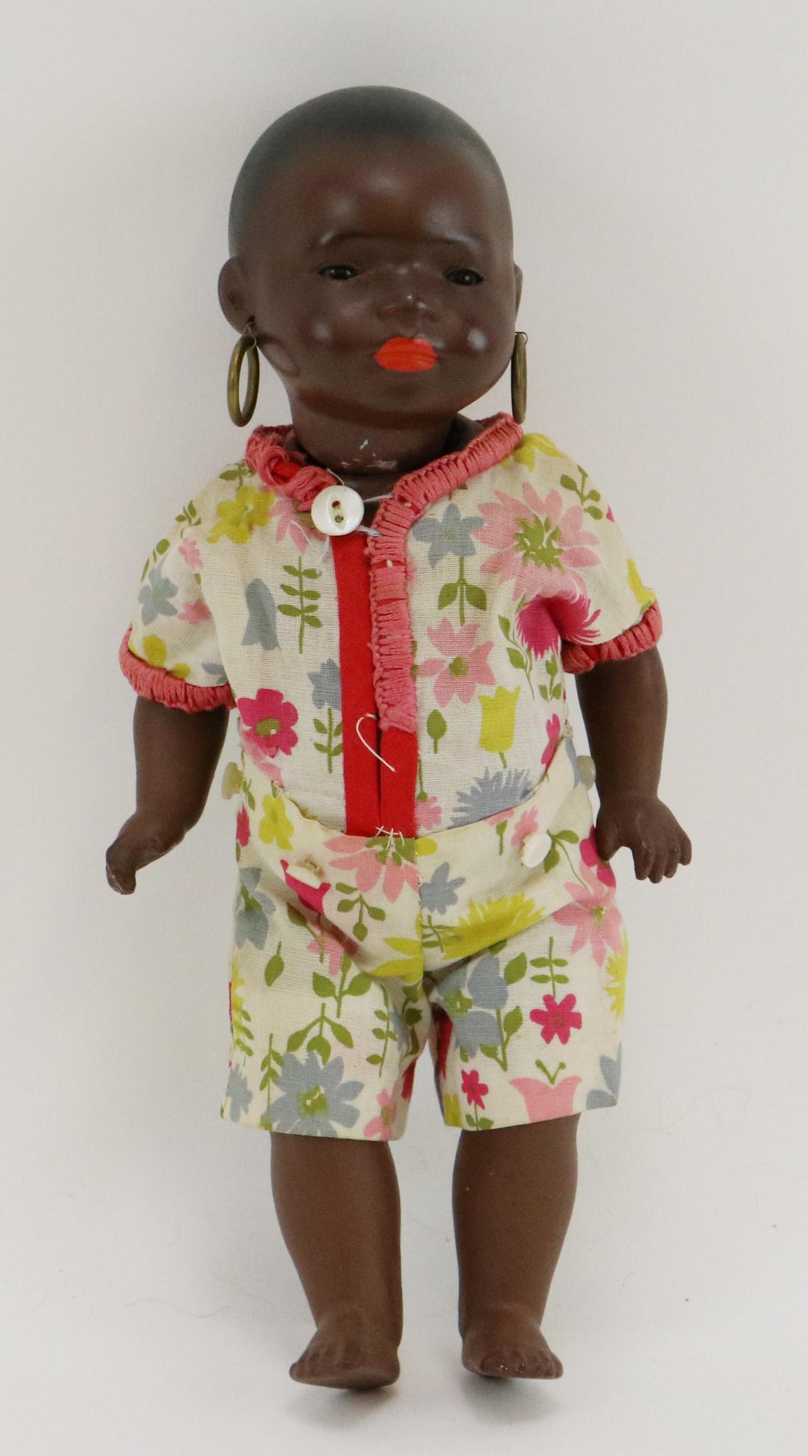 GERMAN BLACK DOLL.: 9 1/2" HEUBACH KOPPLESDORF 399.14/0 GERMANY painted solid dome bisque head character toddler. Stationary brown eyes, closed mouth, painted black hair, brass hoop earrings. 5 Pc. papier mache toddler b