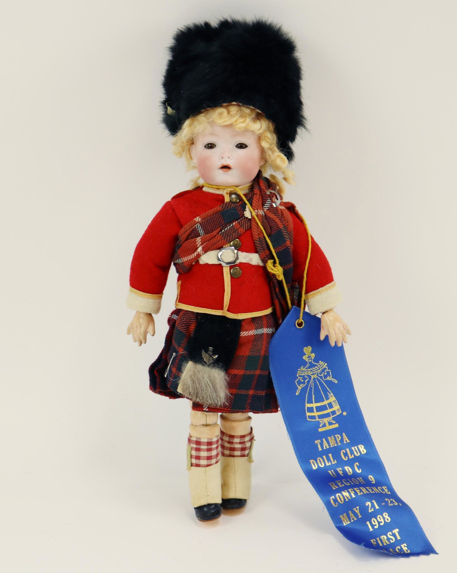 ANTIQUE GERMAN BISQUE DOLL(S), 12" AND UNDER.: 10" 1407/20 GERMANY "Baby Bo Kay" character doll with brown sleep eyes, open mouth, curly blonde mohair wig. Papier mache fully jointed body. Dressed as a Scottish Piper (without pipes) in original cl