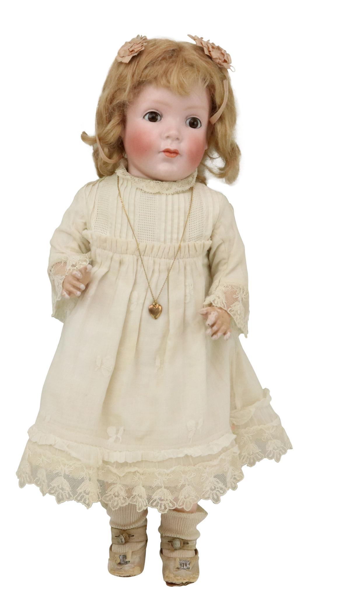ANTIQUE GERMAN BISQUE DOLL.: 18" Ca. 1925 COPR. BY GRACE C. ROCKWELL GERMANY 1392/40 "Pretty Peggy' character girl doll with brown sleep eyes, closed mouth, strawberry blonde mohair wig. Flange neck. Cloth torso, composition arms