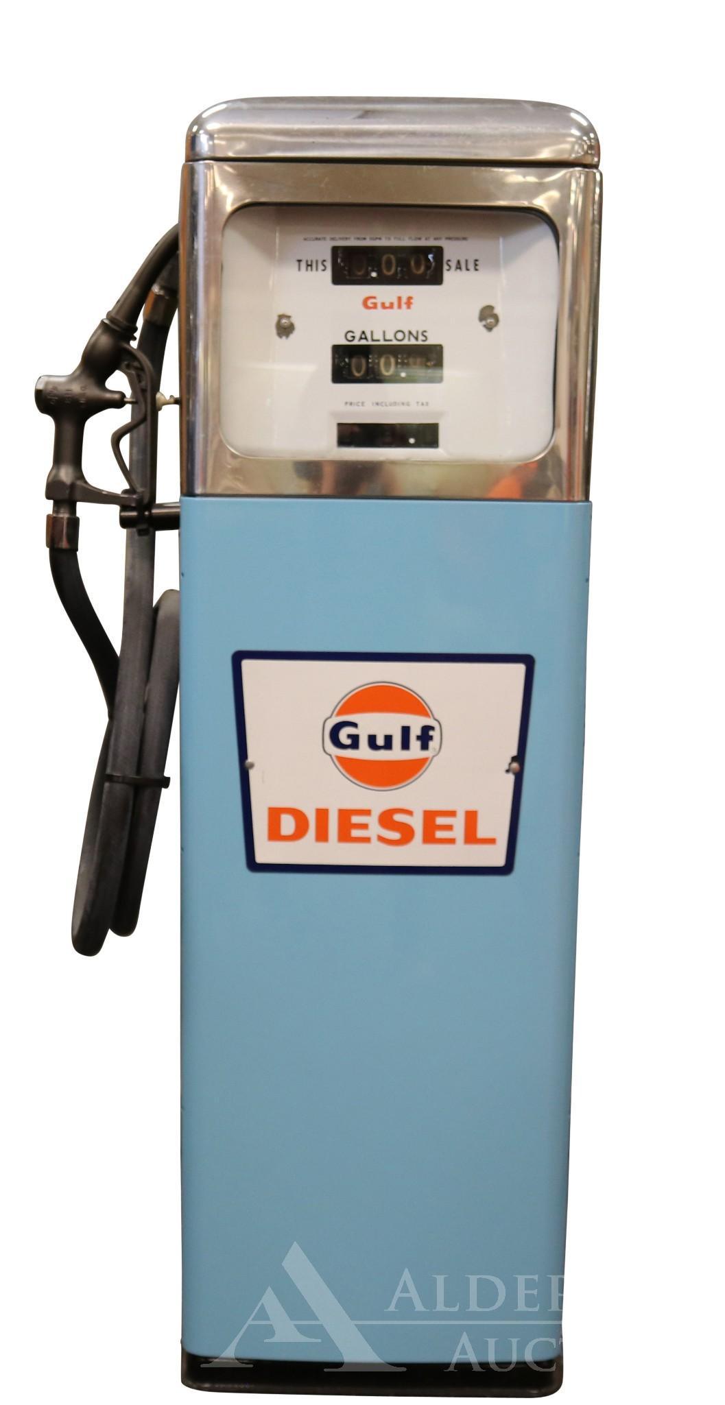 Gulf Diesel Gasoline in Gas Pump: Gulf Gasoline in unlabeled gas pump. Gulf Diesel logo plate attached to front. Porcelain pump face shows wear. Includes nozzle and hose. Measures 22"w x 16"d x 52"h The Alderfer Shipping Department is