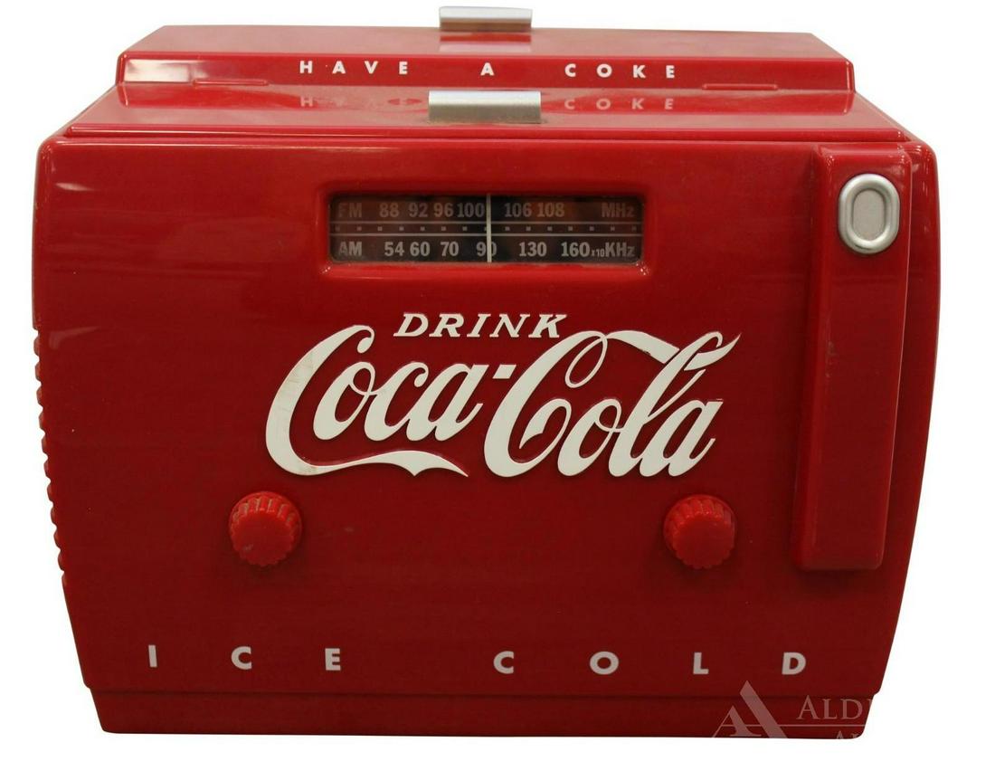 Old-Tyme Coca-Cola Cooler Radio: AM/FM radio and cassette player, ca 1980s. Randix Industries, model number OTR-1949. Measures 12"w x 9"d x 9"h. The Alderfer Shipping Department is not able to ship the majority of items in this aucti