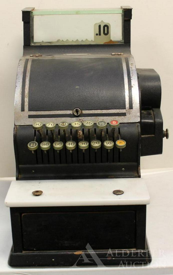 Vintage Cash Register: .Black metal case with porcelain counter. Serial number 2546418 and model number 717. 10"w x 16"d x 17"h. Drawer opens. The Alderfer Shipping Department is not able to ship the majority of items in th