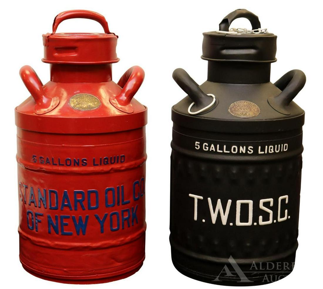 Two Ellisco Motor Oil Cans: 5 gallon T.W.O.S.C. oil can and 5 gallon Standard Oil Co. of New York oil can. Both cans have been repainted/restored. Each can measures 22"h. The Alderfer Shipping Department is not able to ship the