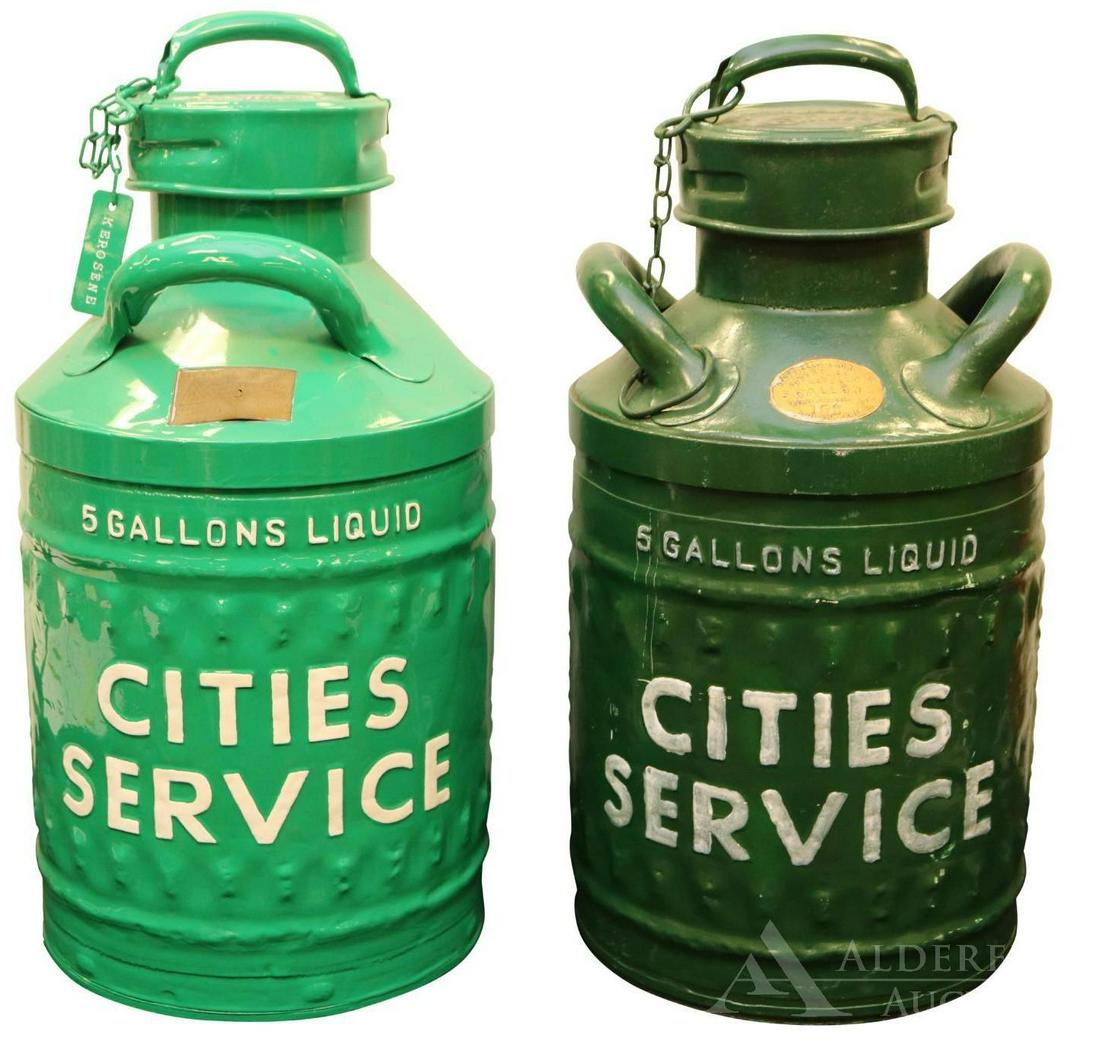 Two Ellisco Motor Oil Cans: Each 5 gallon can marked "Cities Service." Both cans have been repainted/restored. Each can measures 22"h. The Alderfer Shipping Department is not able to ship the majority of items in this auction du