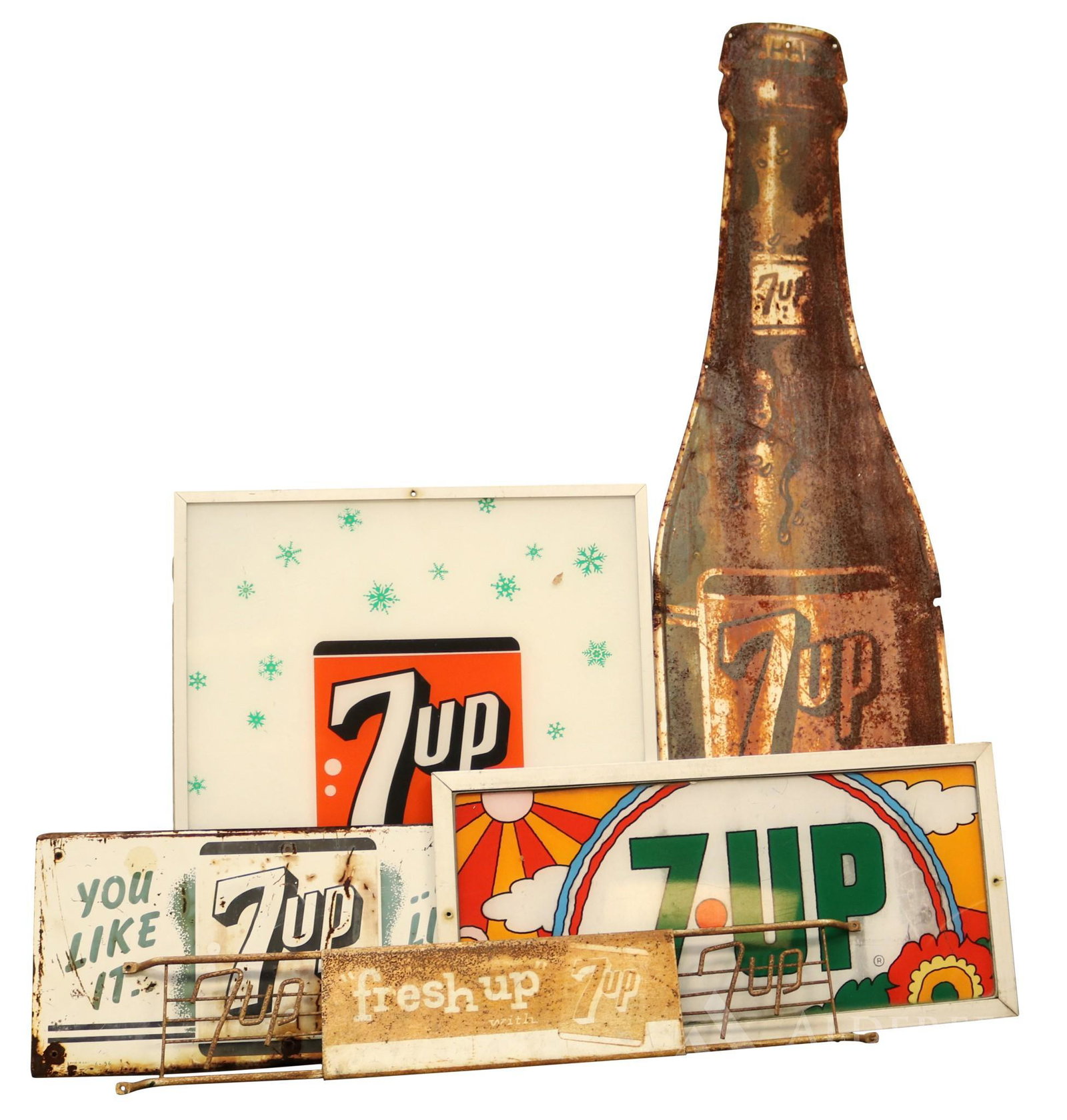 7-Up Advertising Signs: Grouping of 7-up soda advertising signs. includes plexiglass, tin, and glass. Largest measures 20"w x 23.5"h. Some heavily rusted.