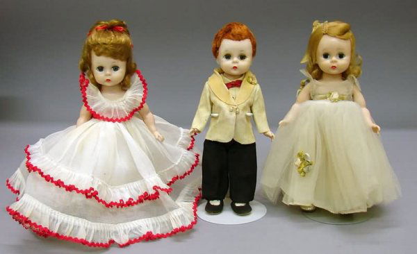 Three 8" 1955-56 Alexander SL and BK Walking Doll: Lot of (3) 8" 1955-56 HP walking dolls. SL - Blonde tagged 1955 #476 Wendy Loves to Waltz. Organdy gown with red rick rack. Condition - dress is not original to doll and has a slight discoloration. Re