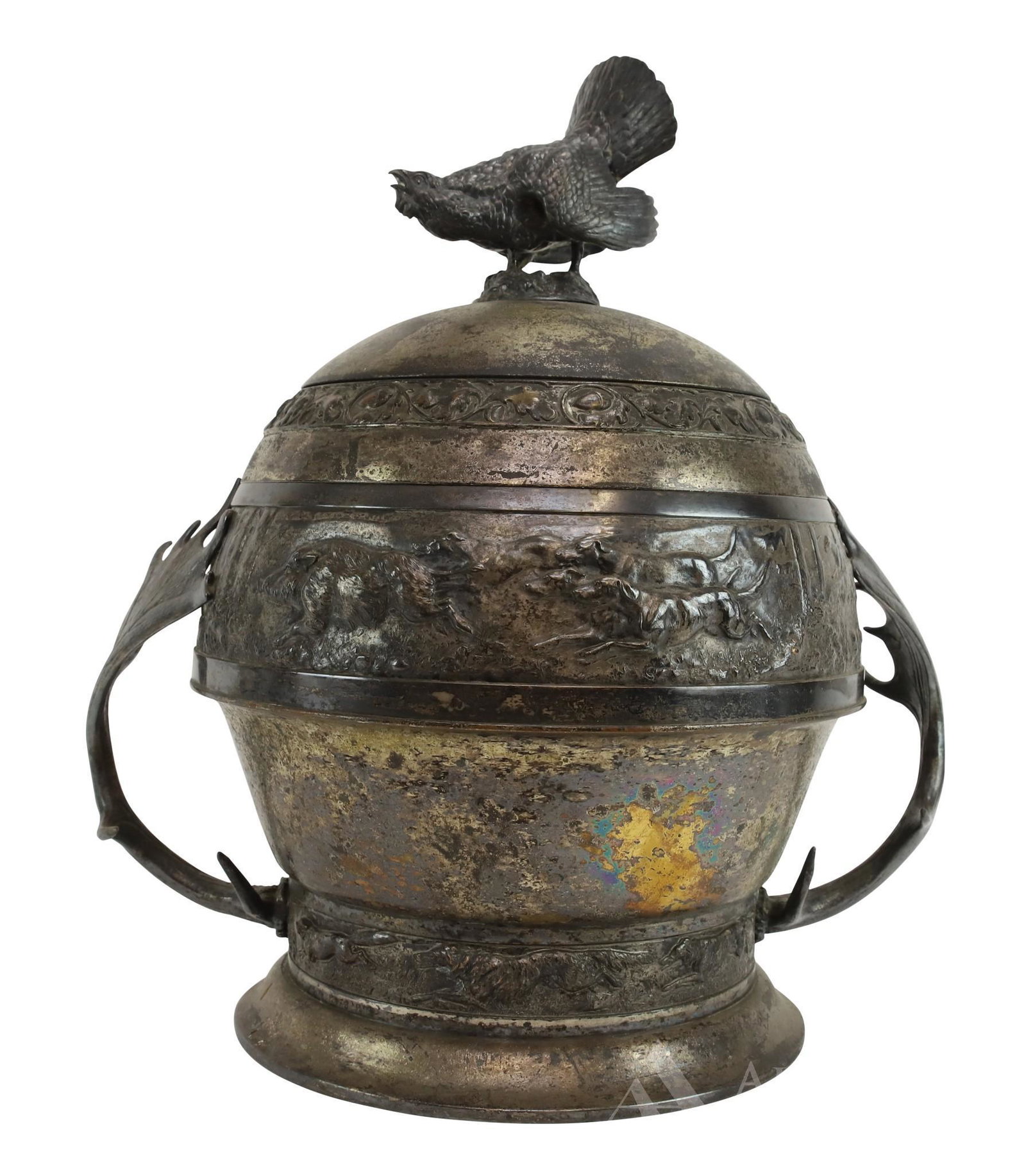 German Hunters Ice Bucket: Silver plated ice bucket by WMF (Württembergische Metallwarenfabrik, or Württemberg Metal Factory), with wood grouse finial, bands of hunting hounds and moose antler handles. Base hallmarked. 18"h 