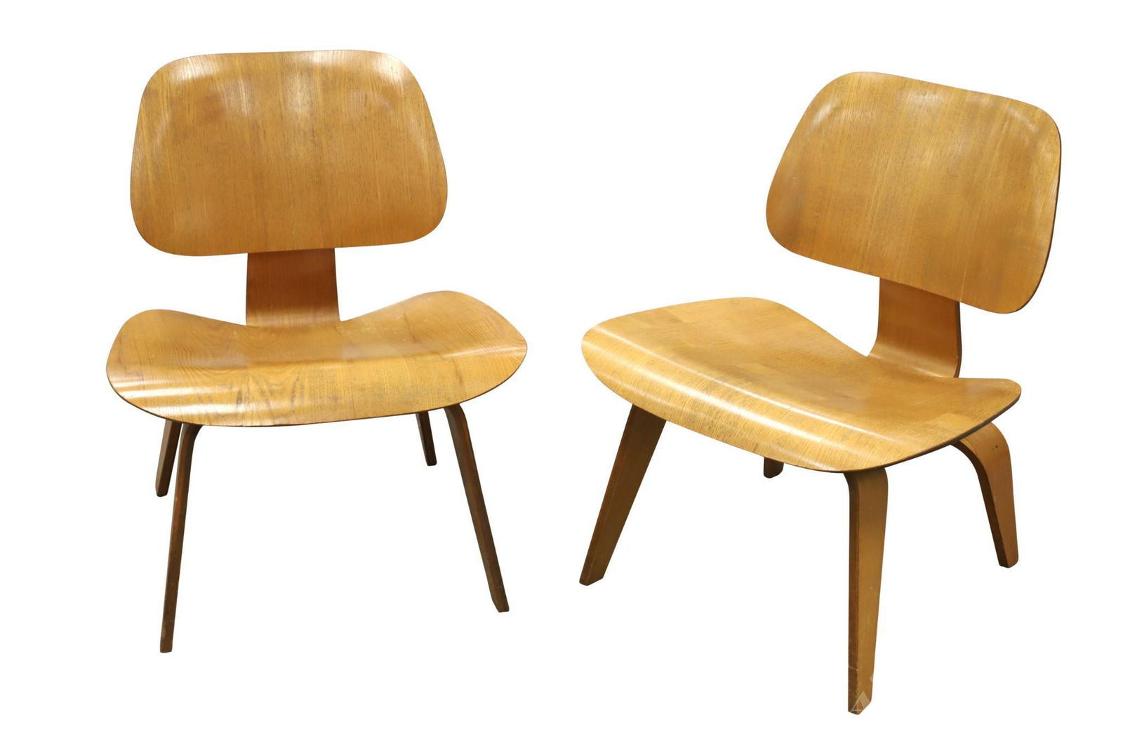 Pair of Charles Eames LCW Chairs: Calico ash molded plywood on tapered legs. 27"h x 22"w x 18"d