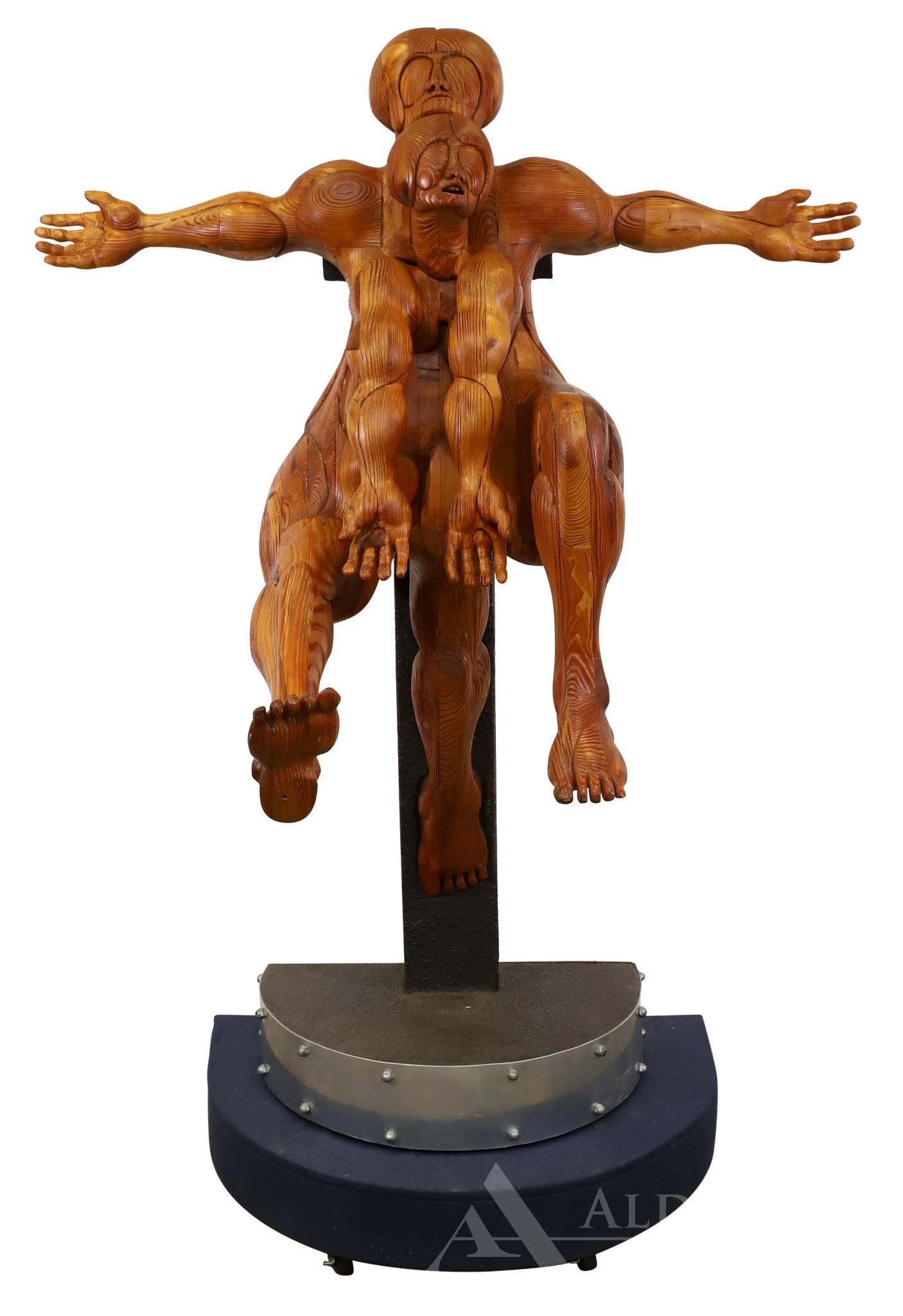 Wayne Forbes (1945-2013): Wood sculpture, "Clone Fix IV", unsigned. Surreal sculpture, figures in crucifixion like pose. 71"h x 46"w x 23"d