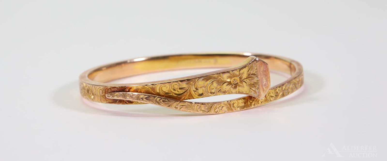 14K Rosy Yellow Gold Etched Spike Bracelet: Hinged bangle. 2 1/2 x 2" I.D. 15mm wide at railroad spike bypass design. Fully etched with polished rectangular boxed spike head. 13.3gtw.