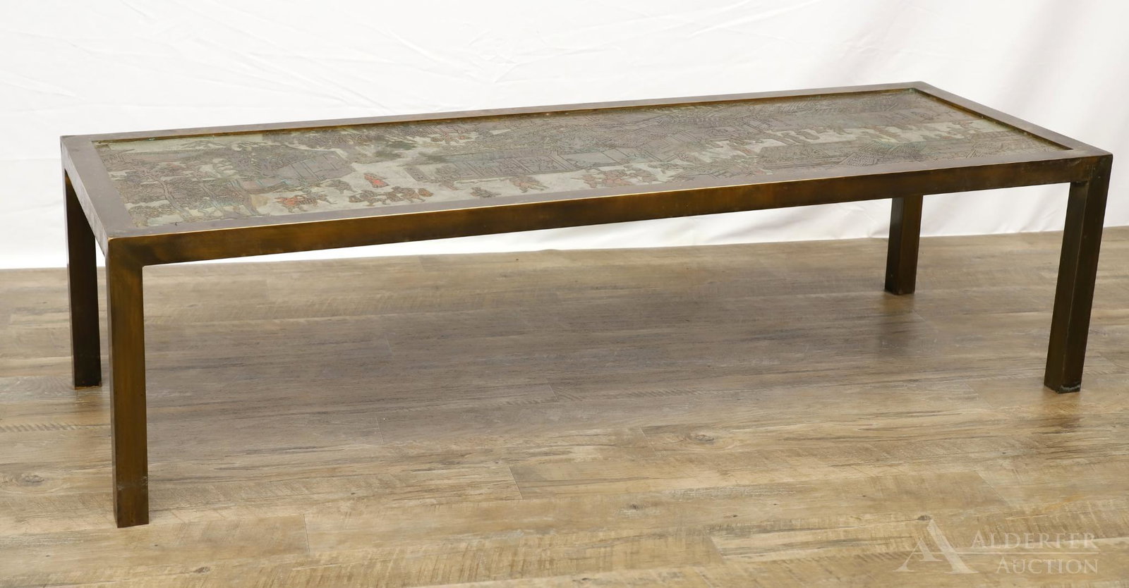 Kelvin and Phillip Laverne Chinoiserie Coffee Table: Signed by both artists on top in two locations, "Kelvin. Philip Laverne" and "Philip & Kelvin Laverne". Engraved with architectural and figural motifs of a village hub on a patinated bronze frame. 15"