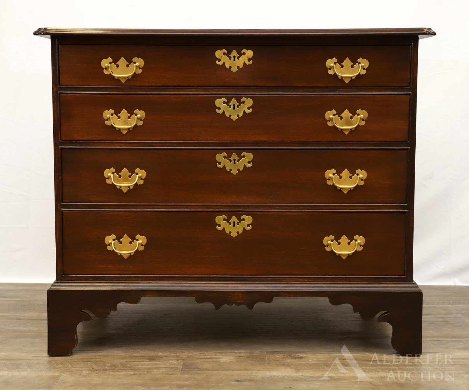 New England Chippendale Birch Chest of Drawers: Chamfered edged top over four graduated drawers on shaped bracket feet. 33"h x 39"w x 23"d