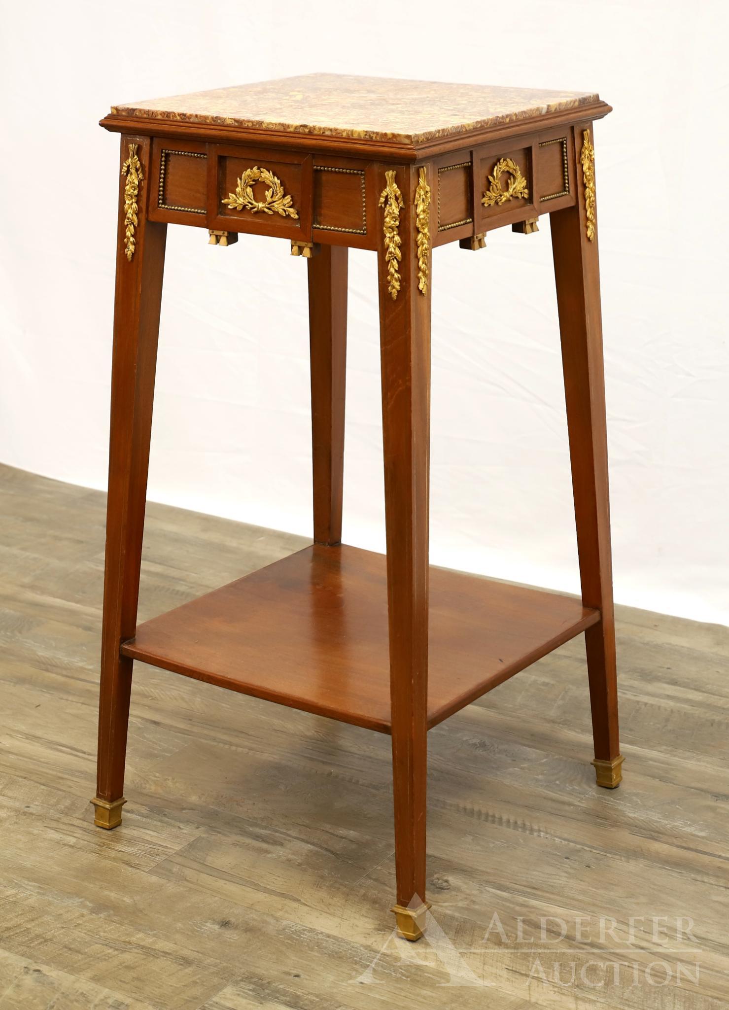 French Ormolu Mounted Stand: Walnut with a granite top, foliate and floral ormolu decoration, bottom tier, on tapered legs with caps. 33"h x 17"w x 17"d
