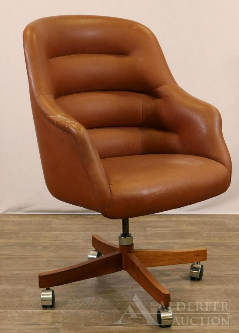 Ward Bennett for Brickel Swivel Chair: Swivel barrel back leather chair with cherry base and chrome double wheel casters. Label underside. 42"h x 26"w x 26"d