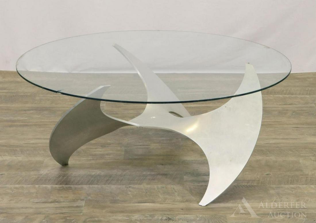 Kurt Hesterberg Propeller Coffee Table: Polished aluminum base with thick round glass top. Glass top is chipped. 15.25"h x 26" round