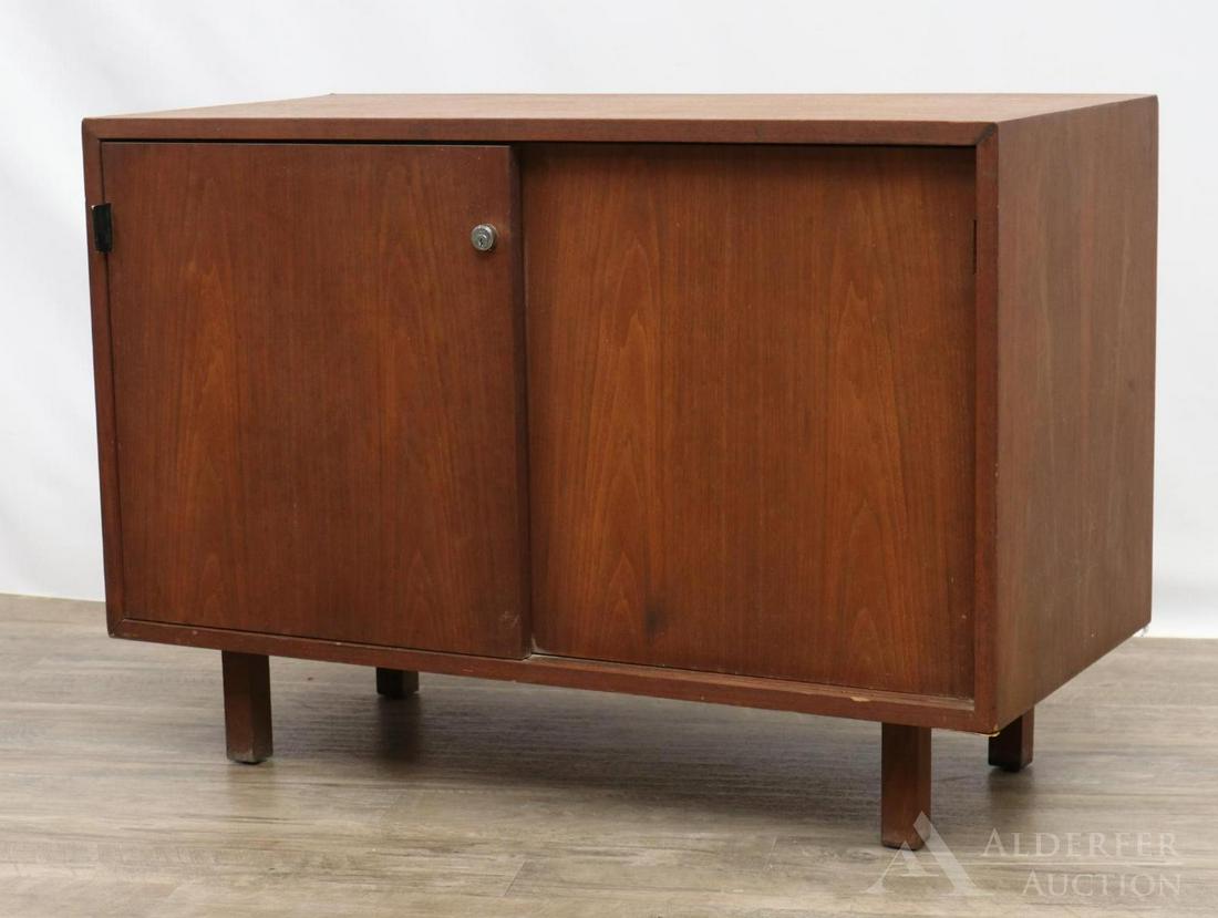 Knoll Side Cabinet: Walnut cabinet with two doors. Marked on reverse. Key is missing. 25.25”h x 36”w x 17.75”d