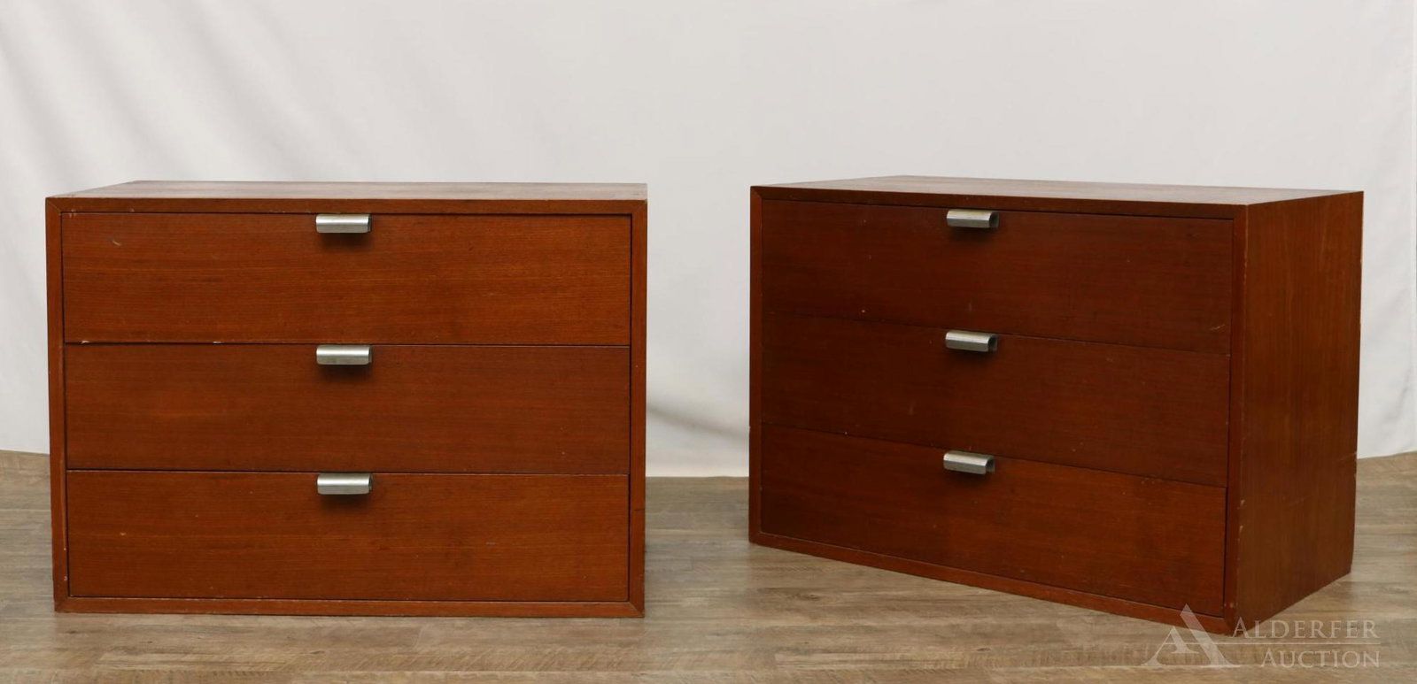 Pair of George Nelson for Herman Miller Chests: Walnut chests with three dovetailed drawers. 24”h x 34”w x 18.5”d