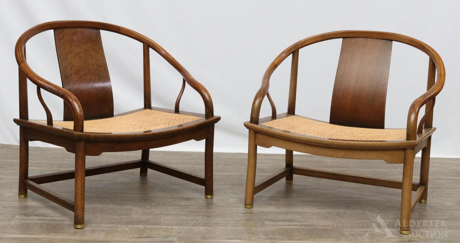Michael Taylor Baker Furniture Lounge Chairs: Walnut and cane armchairs (2). Marked on underside "PEC". 28"h x 28.75"w x 22"d