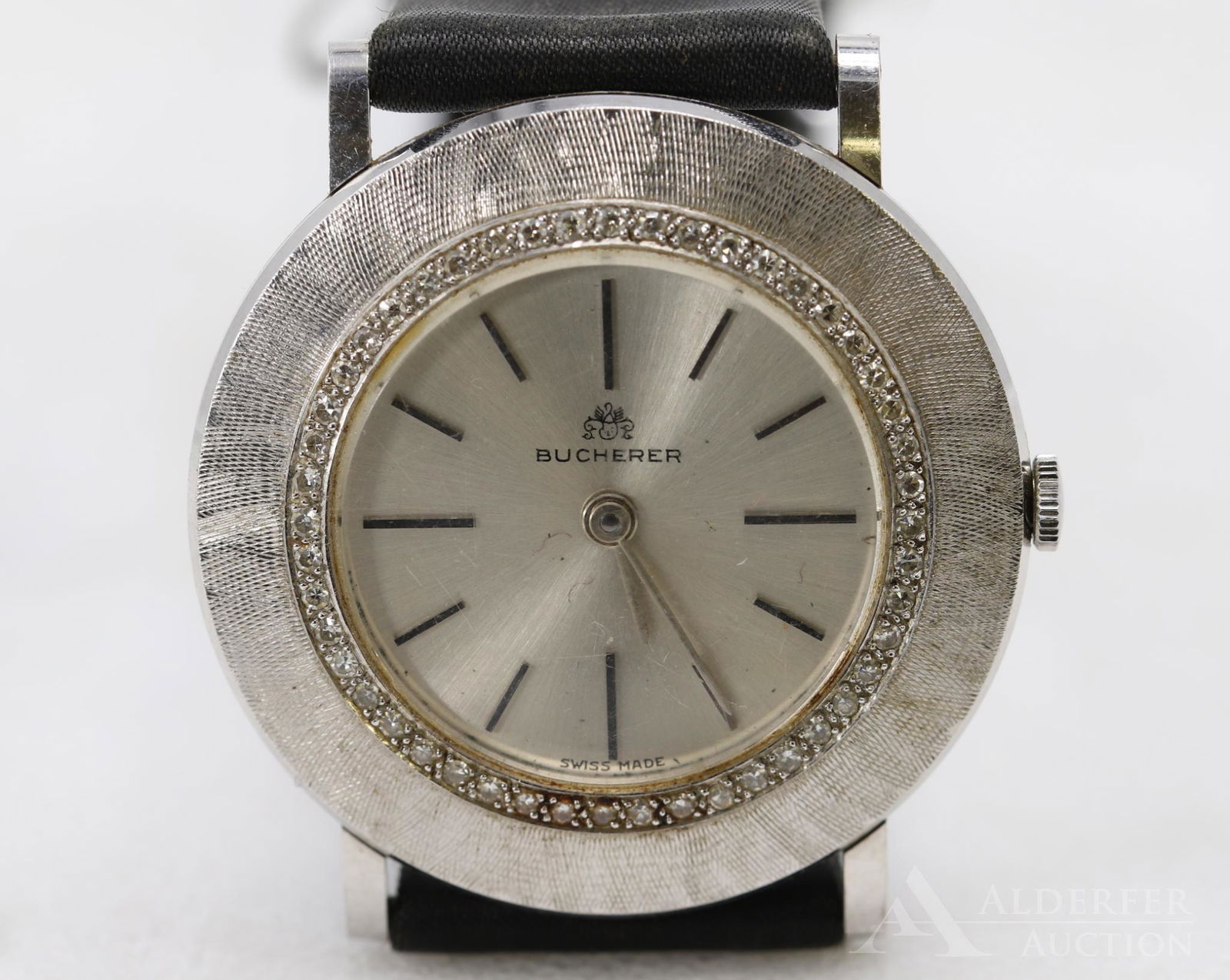 Bucherer 18KW Gold Diamond Bezel Watch: 167142 575. 33mm round case.