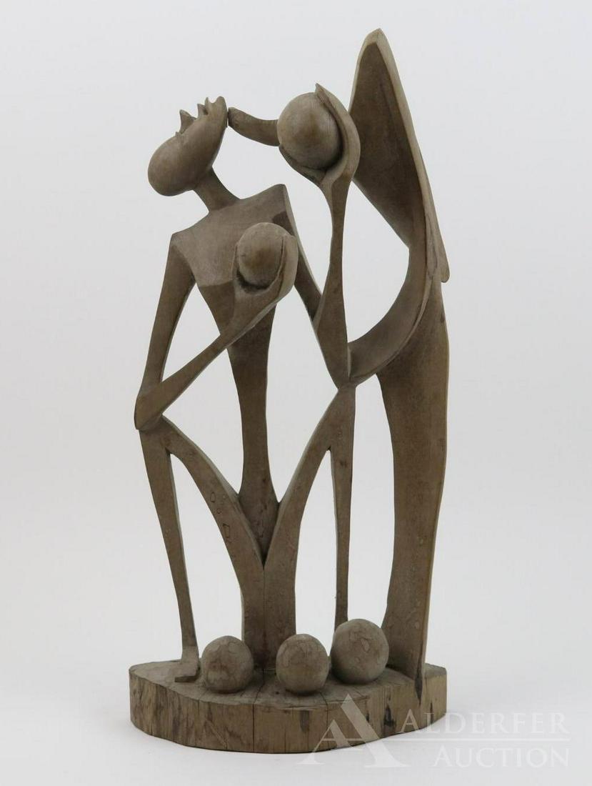 Benoit Konongo (1919 - 2008): Wood, signed to the base. Figural carving with abstract themes. 19.75"h x 10"w