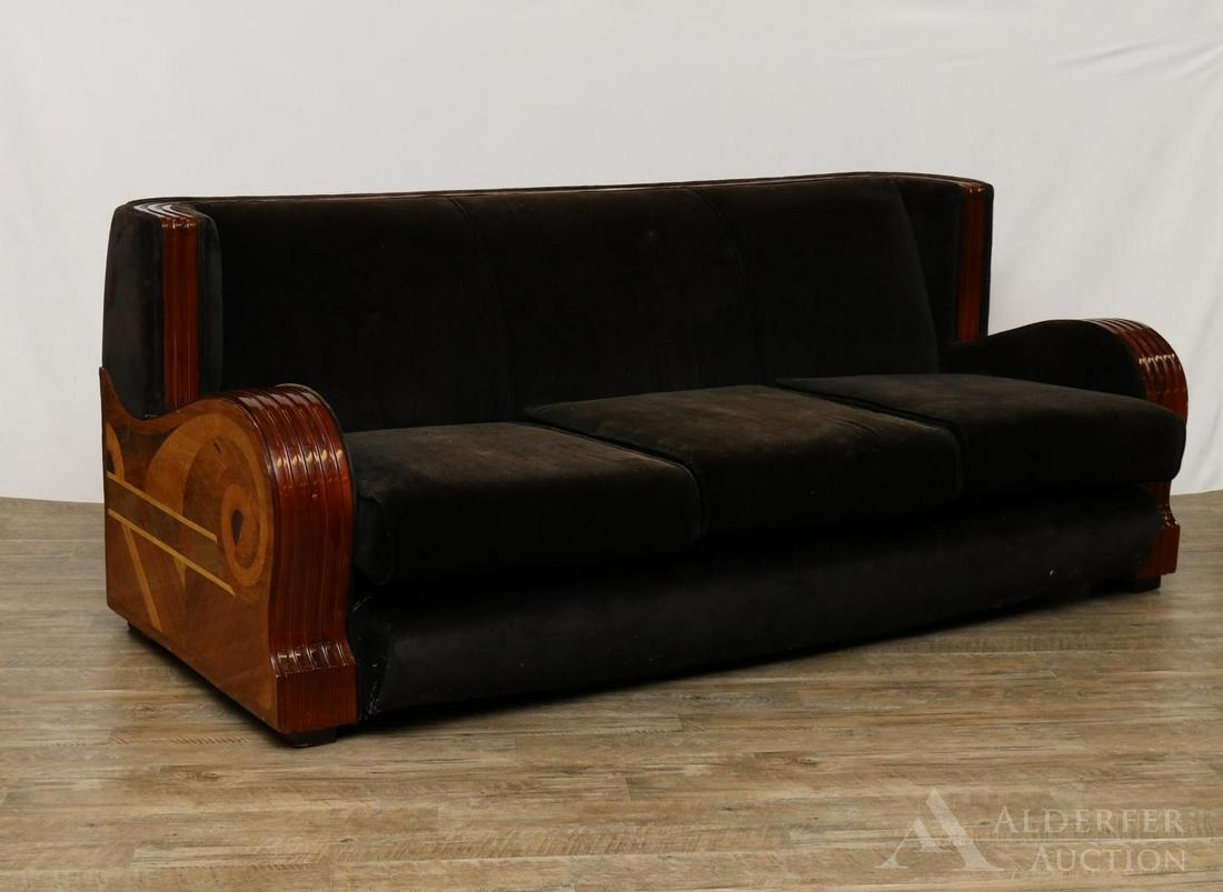 Art Deco Sofa: Black velour upholstery with curved back and arms. Wood frame with marquetry decoration on sides. 31"h x 77"w x 32"d