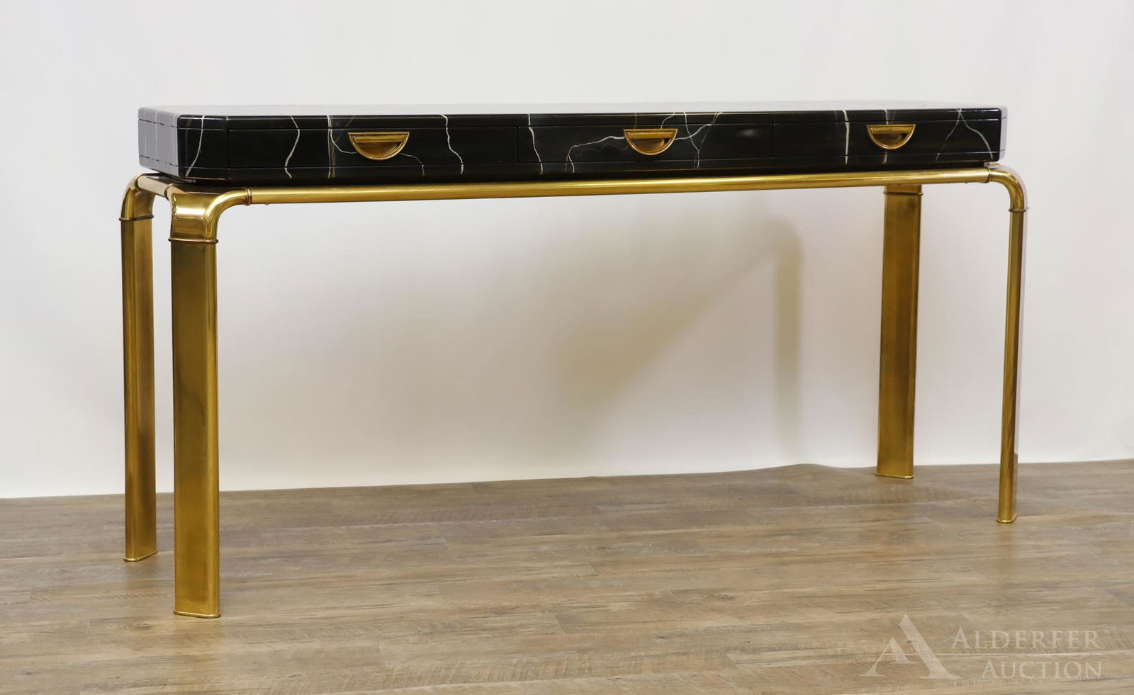 John Widdicomb Sofa Table: Faux marble top with three drawers on brass legs. 30.5"h x 61"w 16"d