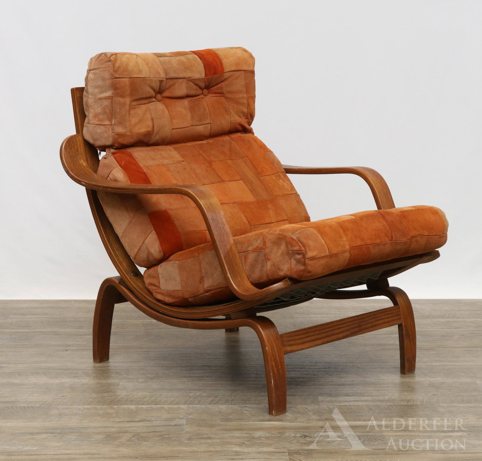 Charlton Lounge Chair: Bentwood chair with slat backs, webbed seat and wide armrests. Multi color suede leather cushion. 29"h x 27.5"w x 32"d