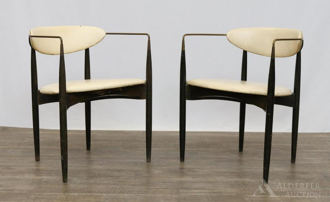 Pair of IB Kofod-Larsen for Selig Arm Chairs: Pair of Ebonized cherry frame chairs with concave back and brass tubular arms conforming to tapered legs. Vinyl seat and back. Label on underside. 28"h x 23"w x 18"d