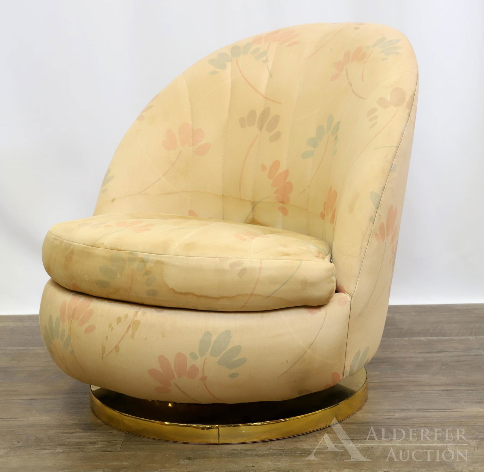 Milo Baughman for Thayer Coggin Lounge Chair: Low barrel back with floral upholstery on brass swivel base. Label on seat. 31"h x 29"w x 23"d