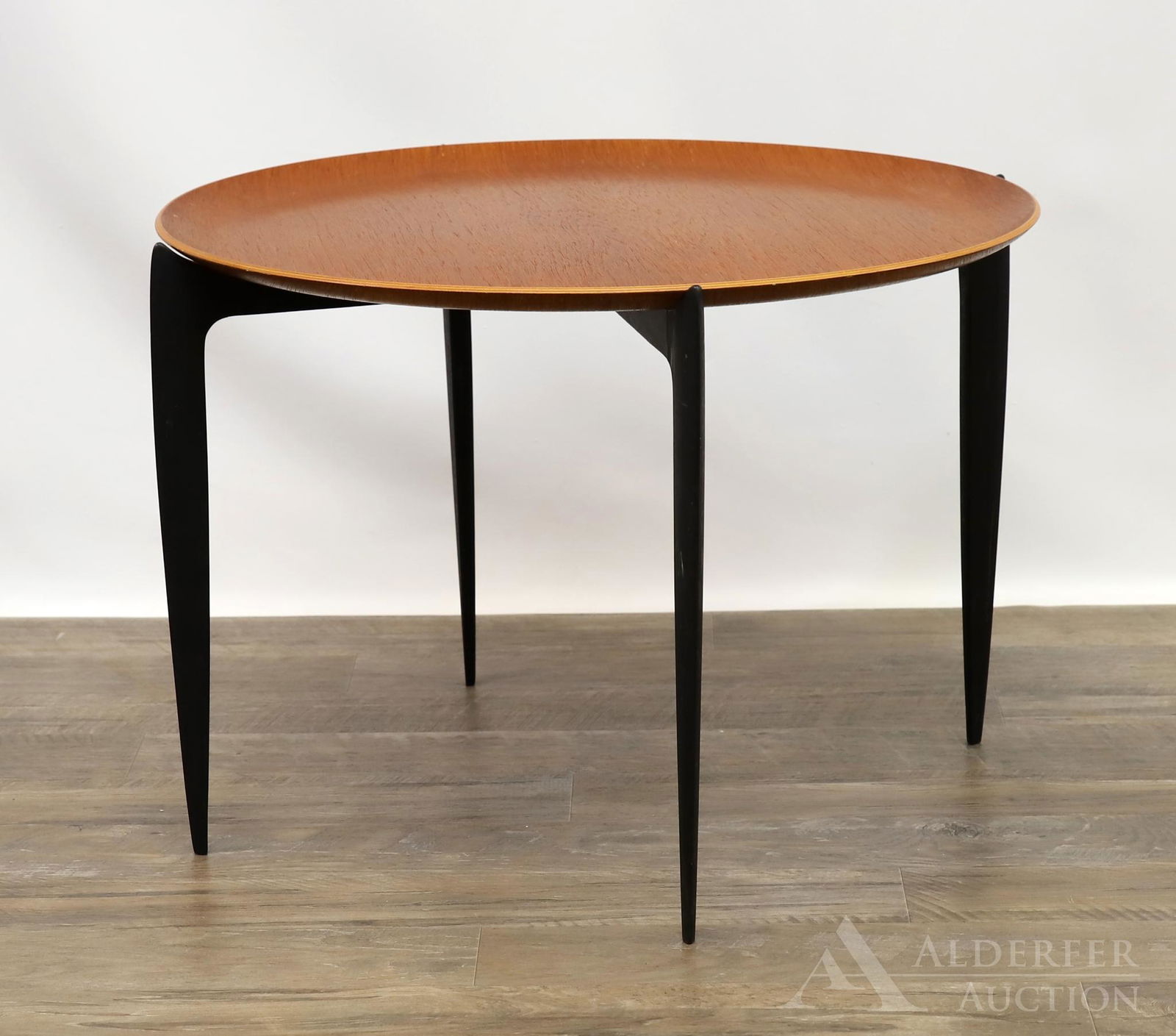 Fritz Hansen for Hans Engholm Folding Table: Teakwood top resting on ebonized folding base. 17"h x 24 round