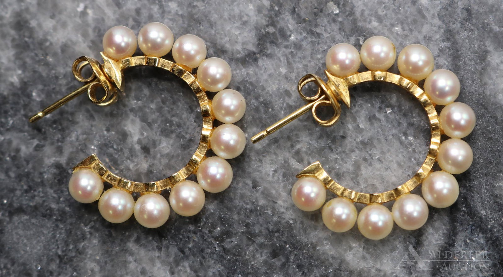 Mikimoto 18KY Gold Pearl Hoop Earrings: Each post and clutch earring features (11) 3.5 - 4mm round Pearls. Mikimoto logo on clutches. 7/8" hoops. 4.0gtw.