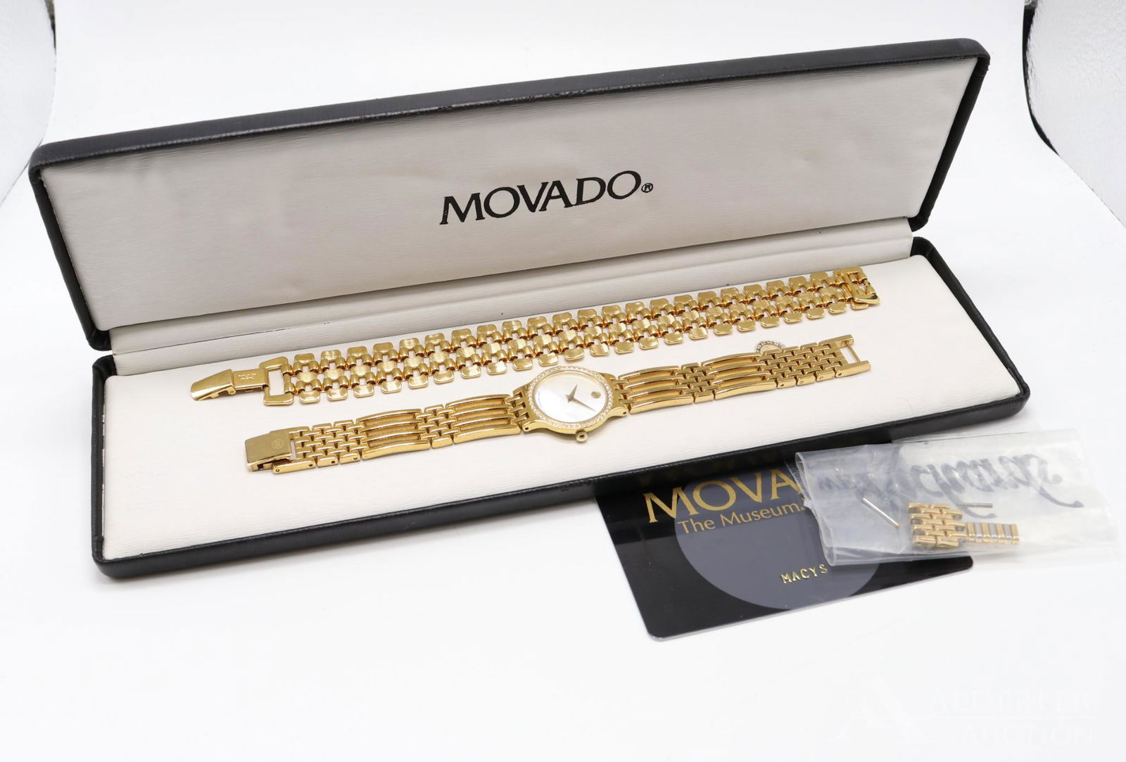 Movado. Ladies Esperanza Wrist Watch: 84.25.811.ISP. 3295937. 23.0mm diameter round case features a Diamond bezel, Sapphire crystal and Mother of Pearl dial. Quartz, water resistant, all steel. 6 1/2" long with yellow gold tone stainles