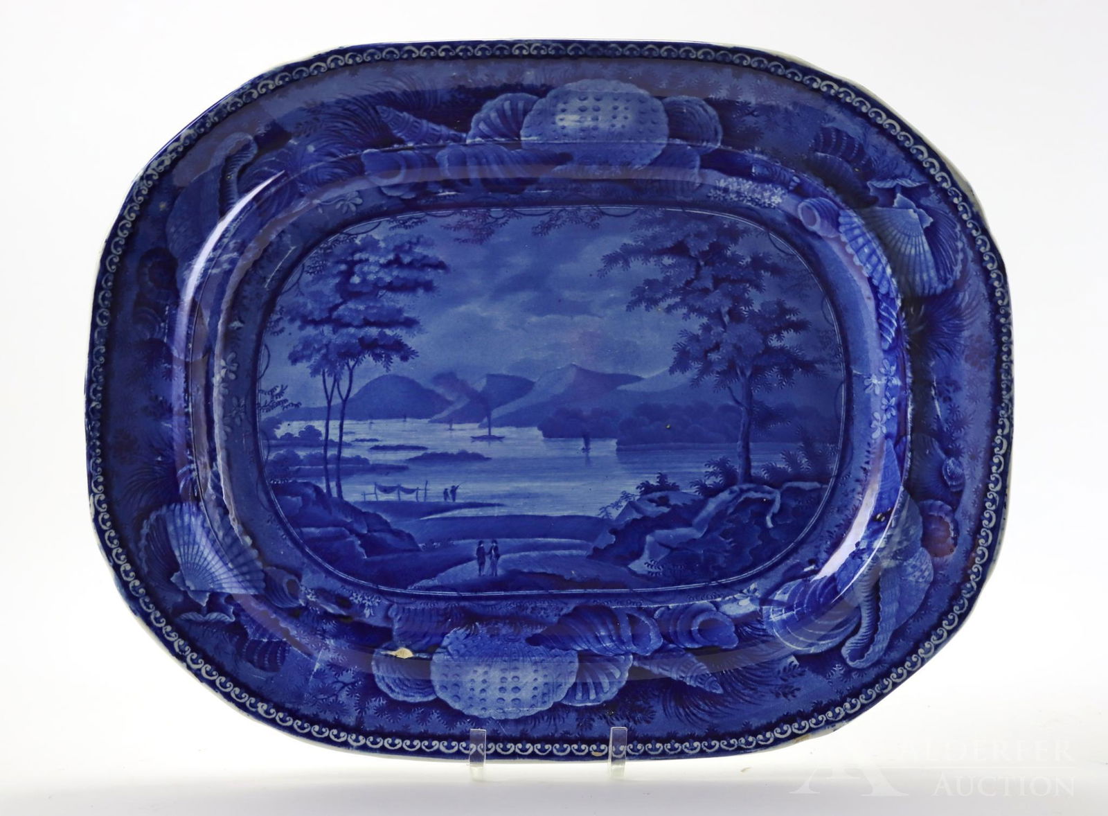 Wood Staffordshire Platter: Historical Staffordshire flow blue platter by English potter, Enoch Wood. "Castle Garden Battery, NY". Small chip on bottom left. 16.5"w x 13"d